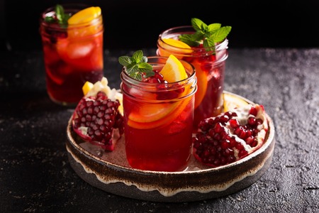 Pomegranate sangria with orangesの写真素材