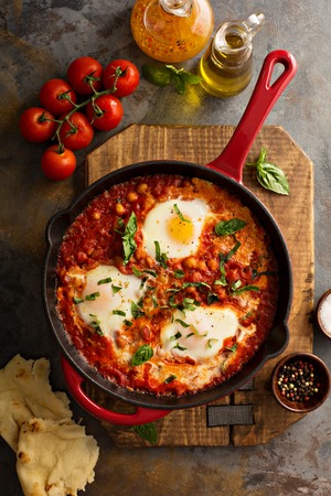 Shakshuka with chickpeas in a skilletの写真素材