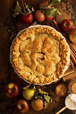 Apple pie decorated with fall leavesの写真素材