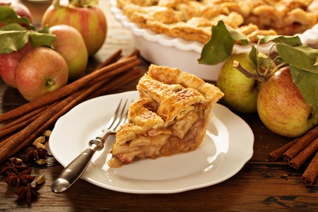 Piece of an apple pie on a plateの写真素材