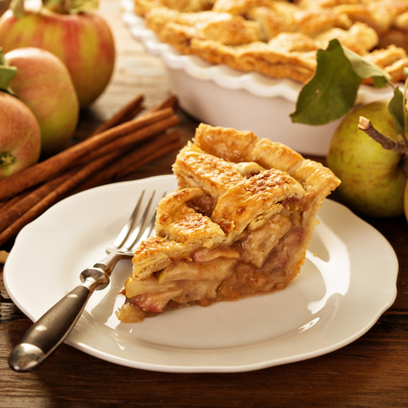Piece of an apple pie on a plateの写真素材