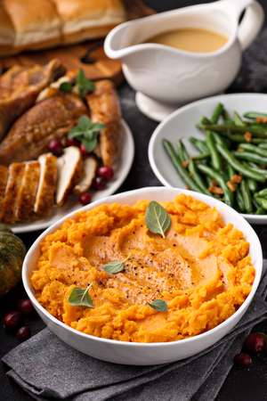 Mashed sweet potatoes on Thanksgiving tableの写真素材