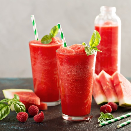 Refreshing cold summer drink watermelon slushie with basilの写真素材