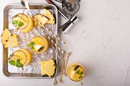 Pineapple cold refreshing margarita cocktails overhead shot with copy spaceの写真素材