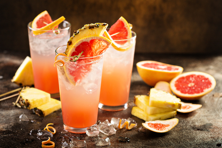 Grapefruit and pineapple cocktail or mocktail, refreshing drink with sparkling waterの写真素材