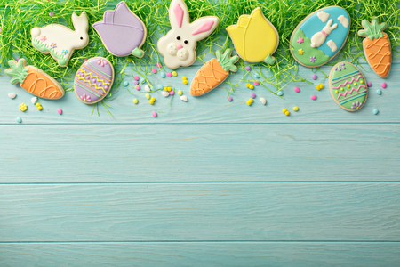 Easter cookies on blue tableの写真素材