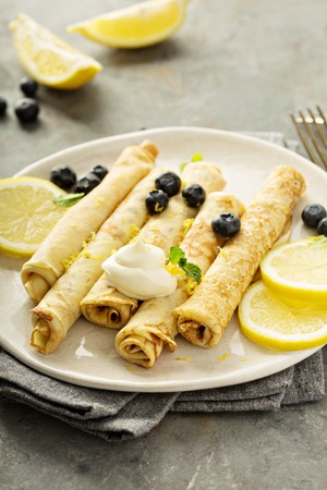 Crepes with lemon filling and blueberriesの写真素材