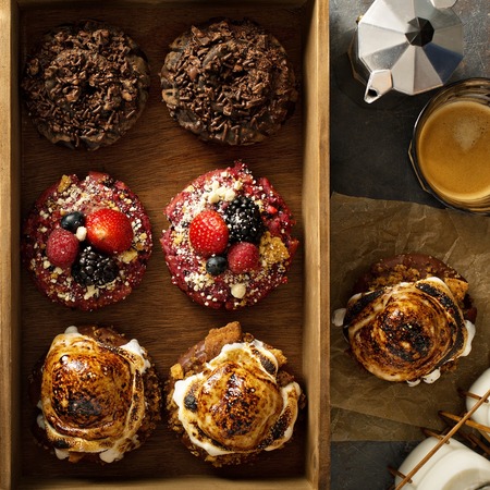 Variety of donuts in a wooden boxの写真素材