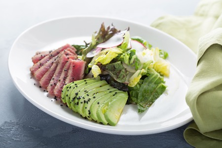 Tuna salad with sliced avocadoの写真素材