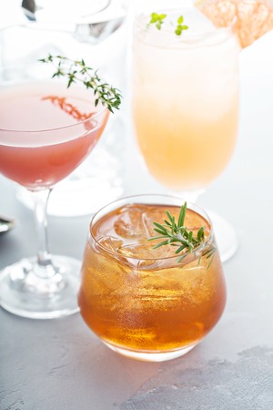 Variety of citrus cocktails on gray surfaceの写真素材