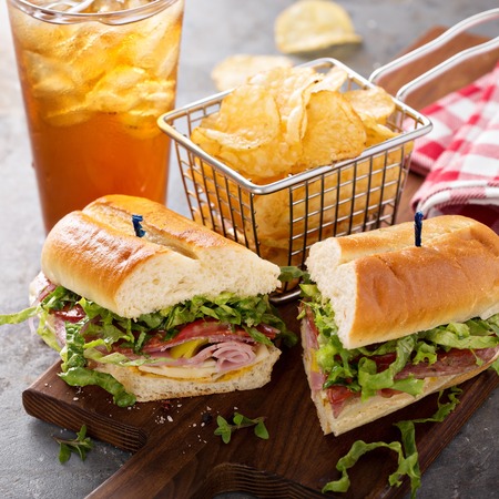 Italian sub sandwich with chipsの写真素材
