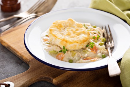 Chicken pot pie with a biscuit on topの写真素材