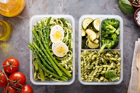 Vegetarian meal prep containers with pasta and vegetables