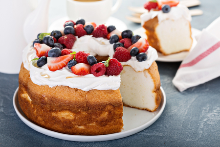 Angel food cake with cream and berriesの写真素材
