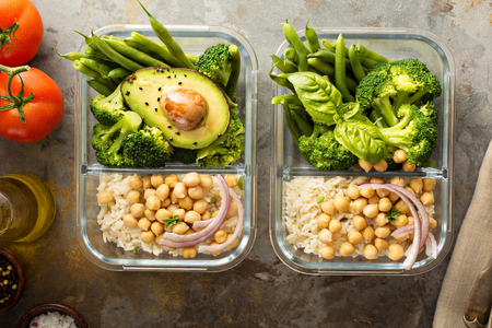 Vegan meal prep containers with cooked rice and chickpeasの写真素材