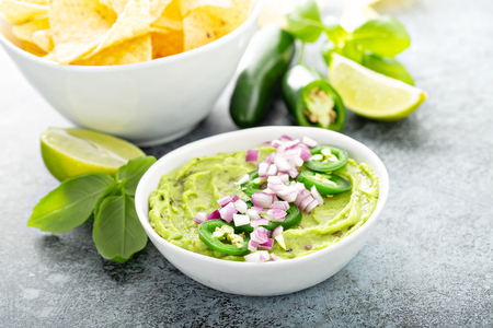 Guacamole with red onion and Jalapeno pepperの写真素材