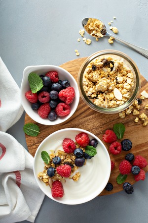 Plain yougurt with granola on sideの写真素材