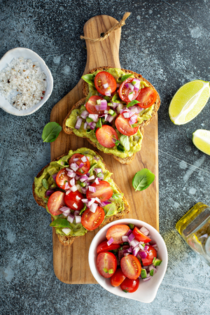 Fresh guacamole and tomato sandwich spreadの写真素材