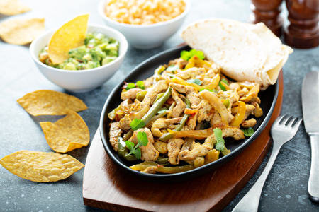 Chicken and bell peppers fajitasの写真素材