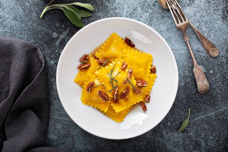 Butternut squash tortellini with brown butter and pecansの写真素材