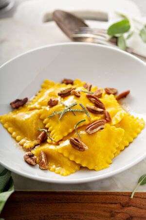 Butternut squash tortellini with brown butter and pecansの写真素材