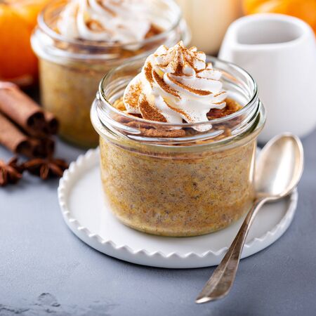 Baked pumpkin oatmeal in a jarの写真素材