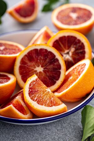 Blood oranges cut into half, juicy winter citrusの写真素材