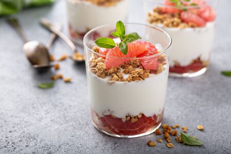 Grapefruit granola and yogurt parfait with honeyの写真素材