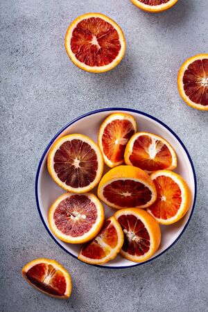 Blood oranges cut into half, juicy winter citrusの写真素材