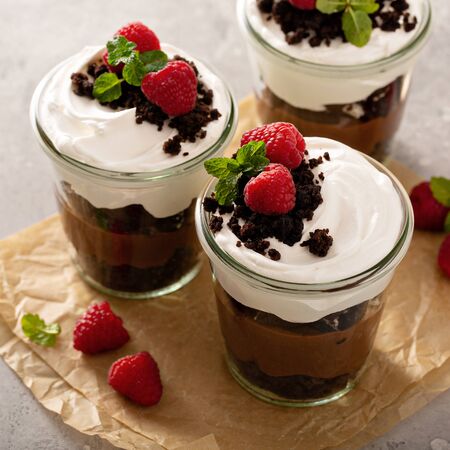 Chocolate layered dessert in a jar with brownie crumbles and pudding