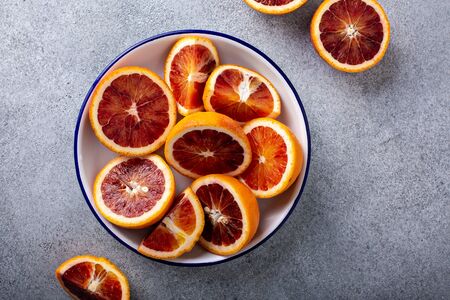 Blood oranges cut into half, juicy winter citrusの写真素材