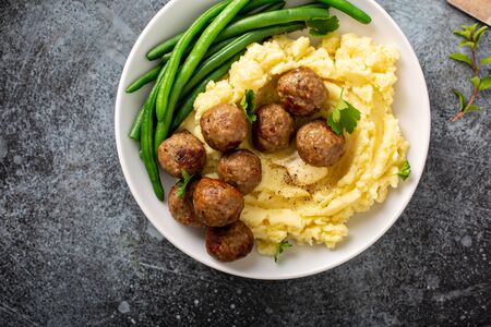 Swedish meatballs with mashed potatoes and green beansの写真素材