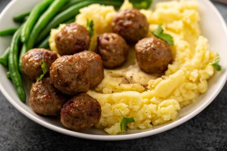 Swedish meatballs with mashed potatoes and green beansの写真素材