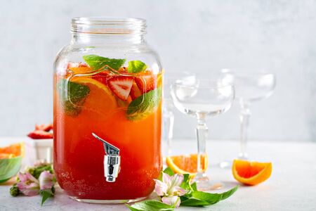 Strawberry, orange and basil sparkling punch, spring cocktail