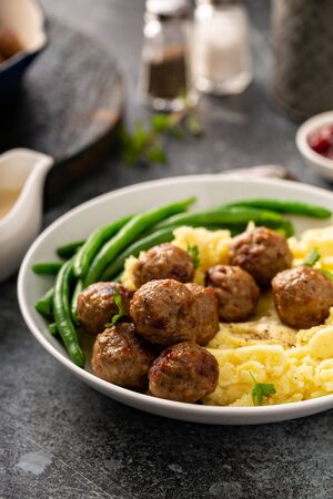 Swedish meatballs with mashed potatoes and green beansの写真素材