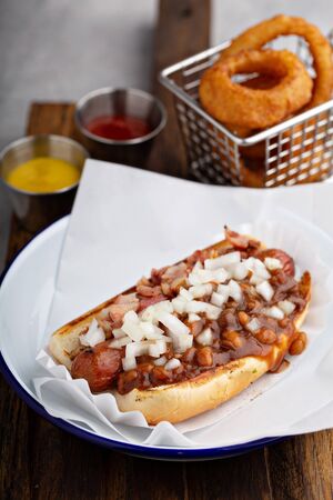 Chili hot dog with beans and onionの写真素材