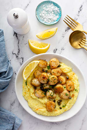 Seared scallops with gritsの写真素材