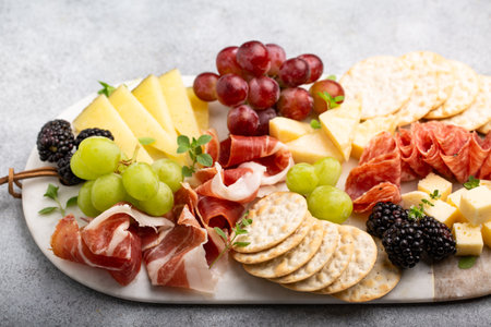 Charcuterie board with variety of cheese and meatの写真素材