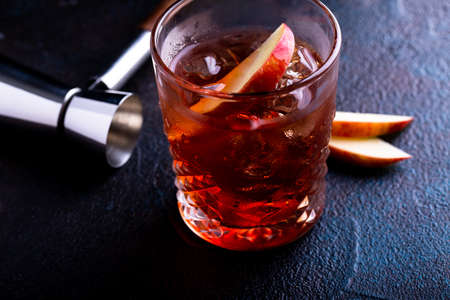 Apple old fashioned cocktail in a glassの写真素材
