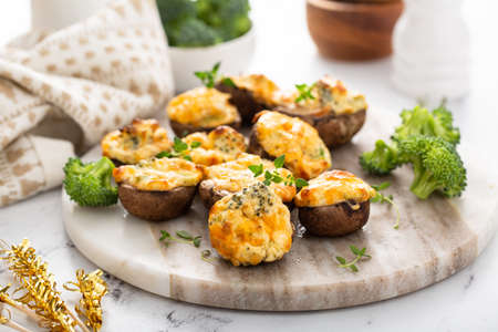 Stuffed mushrooms with broccoli and cheese fillingの写真素材