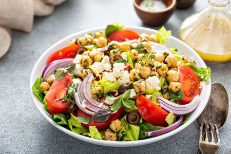 Healthy spring Greek salad with fresh vegetables and chickpeasの写真素材