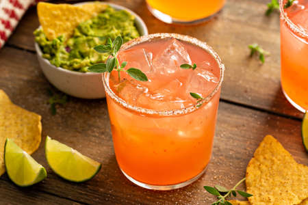 Spicy grapefruit margarita with chips and guacamoleの写真素材
