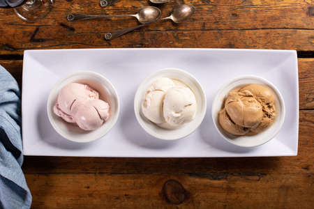 Italian desserts on the table, three kinds of gelato