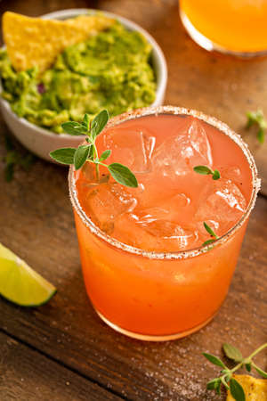 Spicy grapefruit margarita with chips and guacamoleの写真素材
