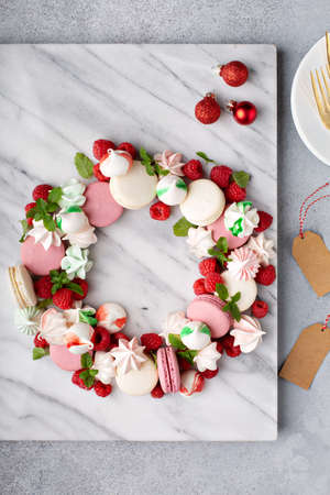 Christmas dessert wreath with macarons and meringuesの写真素材