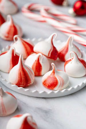 Peppermint meringues on a marble table, Christmas treatの写真素材