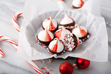 Peppermint meringues dipped in chocolate, Christmas treatの写真素材