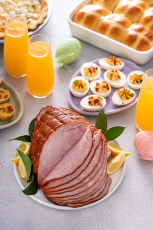 Traditional Easter ham on the table served with Easter brunchの写真素材