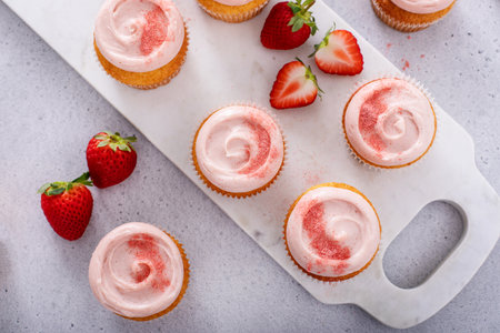 Strawberry lemonade cupcakes with a swirl of strawberry cream cheese frostingの写真素材