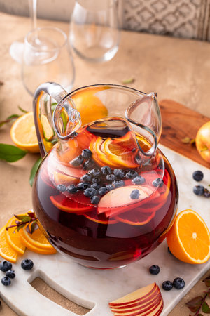 Refreshing summer berry sangria with apples, oranges and blueberryの写真素材